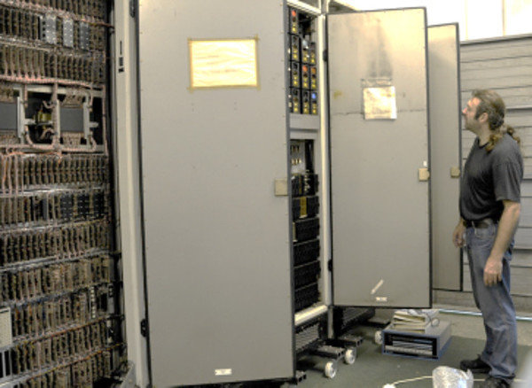 Three tall metal cabinets, towering over the author